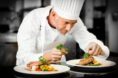 French chef finalizing a meal